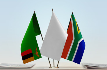 Flags of Zambia and Republic of South Africa with a white flag in the middle
