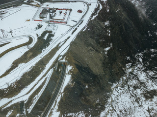 aerial top view of the winter rainy cloudy day in the mountains