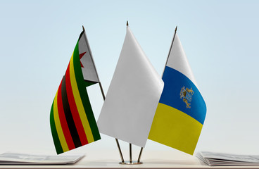 Flags of Zimbabwe and Canary Islands with a white flag in the middle