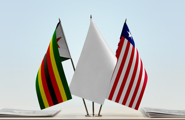 Flags of Zimbabwe and Liberia with a white flag in the middle