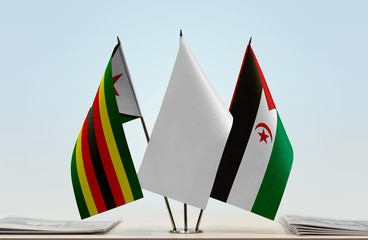 Flags of Zimbabwe and Sahrawi Arab Democratic Republic with a white flag in the middle