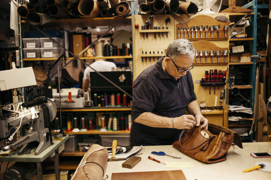 Man in leather workshop