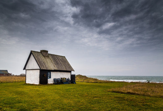 White Stone House On The Coast On A Cloudy Day