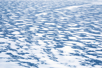 frozen lake covered with snow