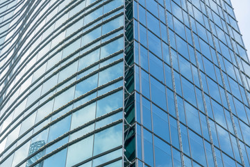 Fototapeta na wymiar Glass walls of urban skyscrapers