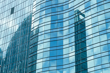 Glass walls of urban skyscrapers