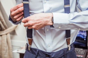 Man is preparing to get dressed up