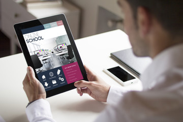 businessman browsing online school with tablet pc