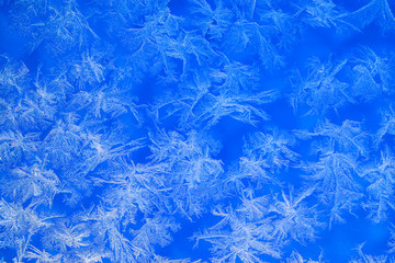 Fototapeta na wymiar frosty pattern on glass. ice pattern on window closeup