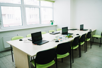 interior of classroom with laptops on desk at stem education courses