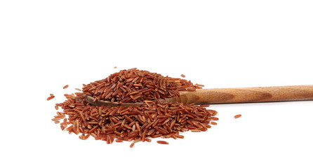 Red wild rice pile in wooden spoon isolated on white background