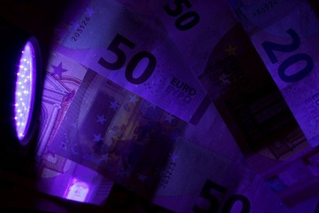 Banknotes in UV light.