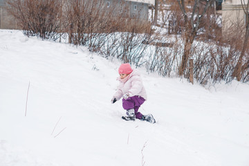 Girl Playing in Snow