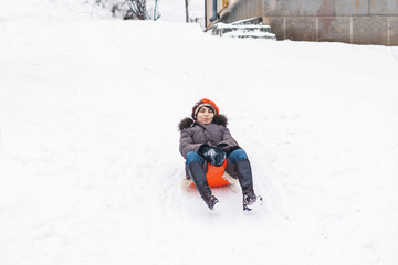 Woman Sliding Down with Sledge