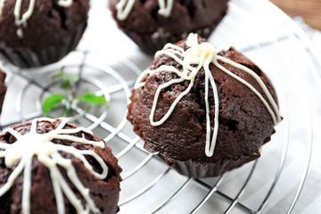 Tasty chocolate cupcakes on cooling rack