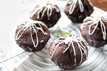 Tasty chocolate cupcakes on cooling rack