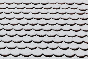 Snow covered brick roof