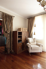 vintage room with wooden cupboard and armchair style.