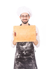 holding a wooden cutting board