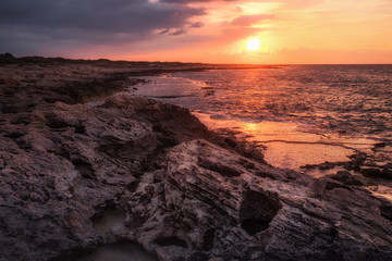 Beautiful sunset at the rocky coastline