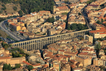 Fototapeta premium Aerial view of Segovia, medieval city of Spain. It shows the aqueduct and the downtown area of the city.