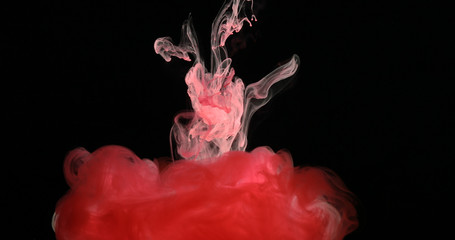 Red Ink Paint in Water Creating Liquid Artistic Shapes
