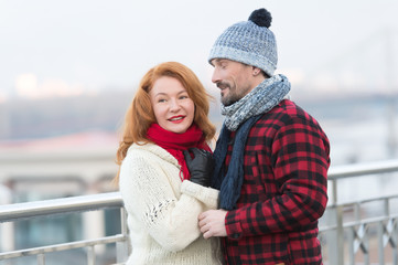 Men loves rude women with closed eyes. Guy in rad jacket and scurf happy to women in red scurf. Aged couple meet in city. City life of lovely people.