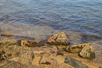 Sea waves splashing over rocks