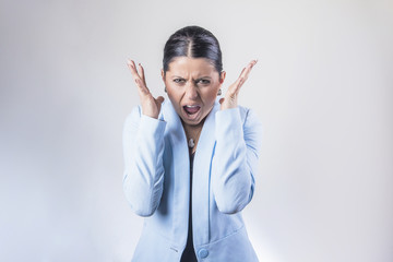 Screaming furious business woman expressing dissatisfaction and annoyance