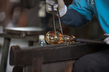 Molten glass on a metal rod