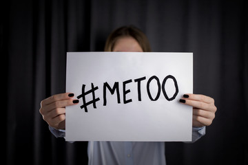 young woman holding #MeToo poster. concept protests against sexual harassment. close up,.selective focus