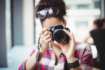 Woman photographing at restaurant