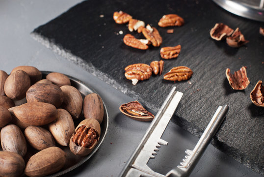 Pecan nuts with nutcracker