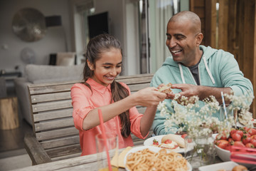Father Passing a Sandwich