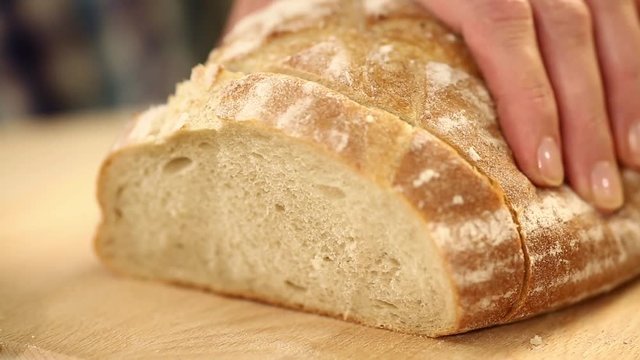 Cut bread female hands with knife