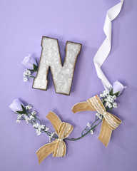 Tin letter N with purple roses