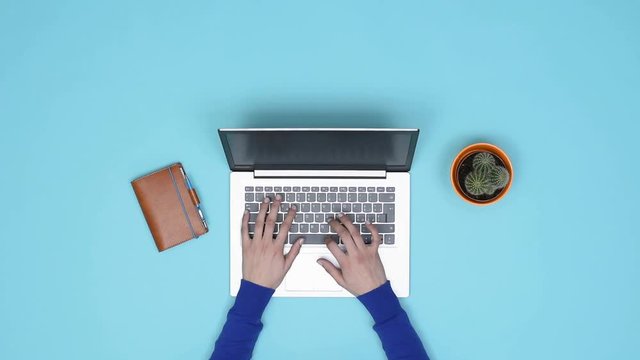 Minimalist desktop and woman working with a laptop
