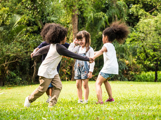 Group of children playing together in the park