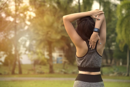 female exercising stretch her arms relax to muscle.
