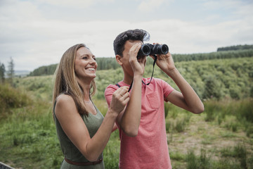 Teenage Male Using Binoculars