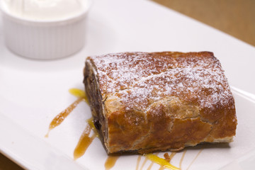 Sweet dessert apple strudel with ice cream