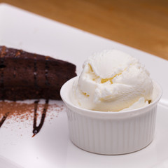Piece of chocolate almond cornmeal cake and ice cream