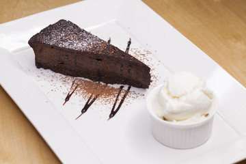 Piece of chocolate almond cornmeal cake and ice cream