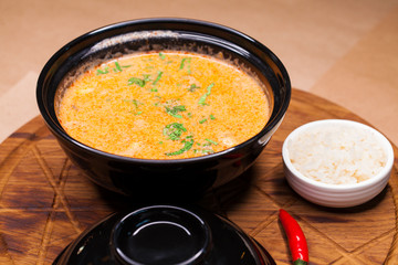 Tom Yam Kung, thai food on a wooden tray
