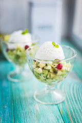 fruit salad with ice cream on a blue background