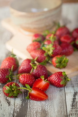 Strawberry In a bowl On a Wooden Background
