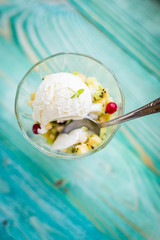 fruit salad with ice cream on a blue background