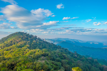Obraz premium Mountains and tree with beautiful blue sky and cloud in the morning.