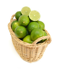 Fresh ripe lime isolated in basket on white background