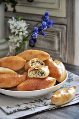 On a platter Russian traditional patties with rice and egg
